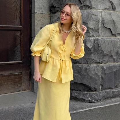 Jupe plissée à lacets et manches bouffantes