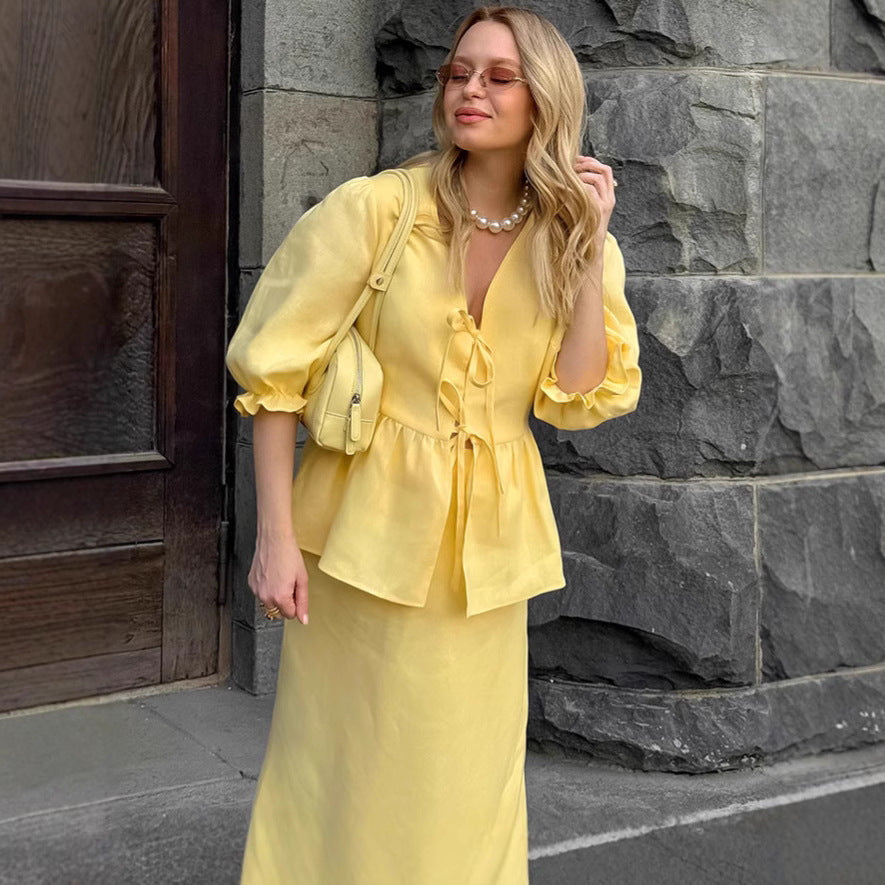 Jupe plissée à lacets et manches bouffantes