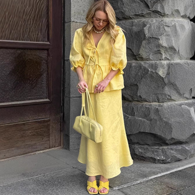 Jupe plissée à lacets et manches bouffantes