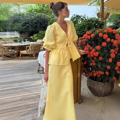 Jupe plissée à lacets et manches bouffantes