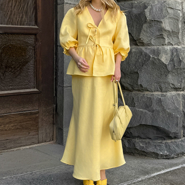 Jupe plissée à lacets et manches bouffantes